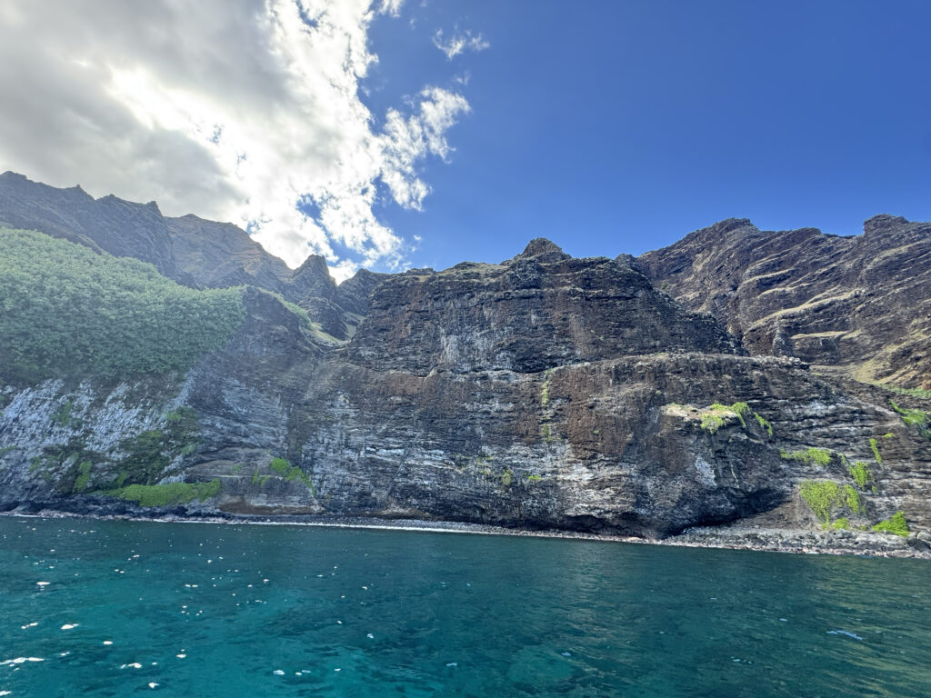 Na Pali Coast towering cliffs from catamaran boat tour
