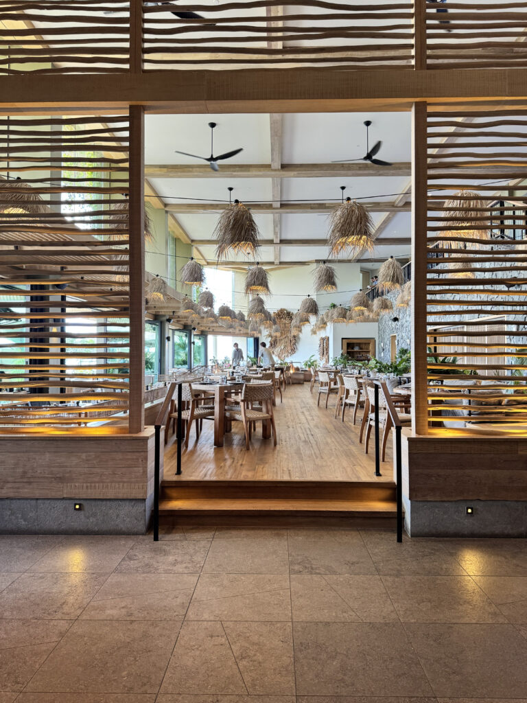 1 Kitchen restaurant entrance with wood slat details at 1 Hotel Hanalei Bay