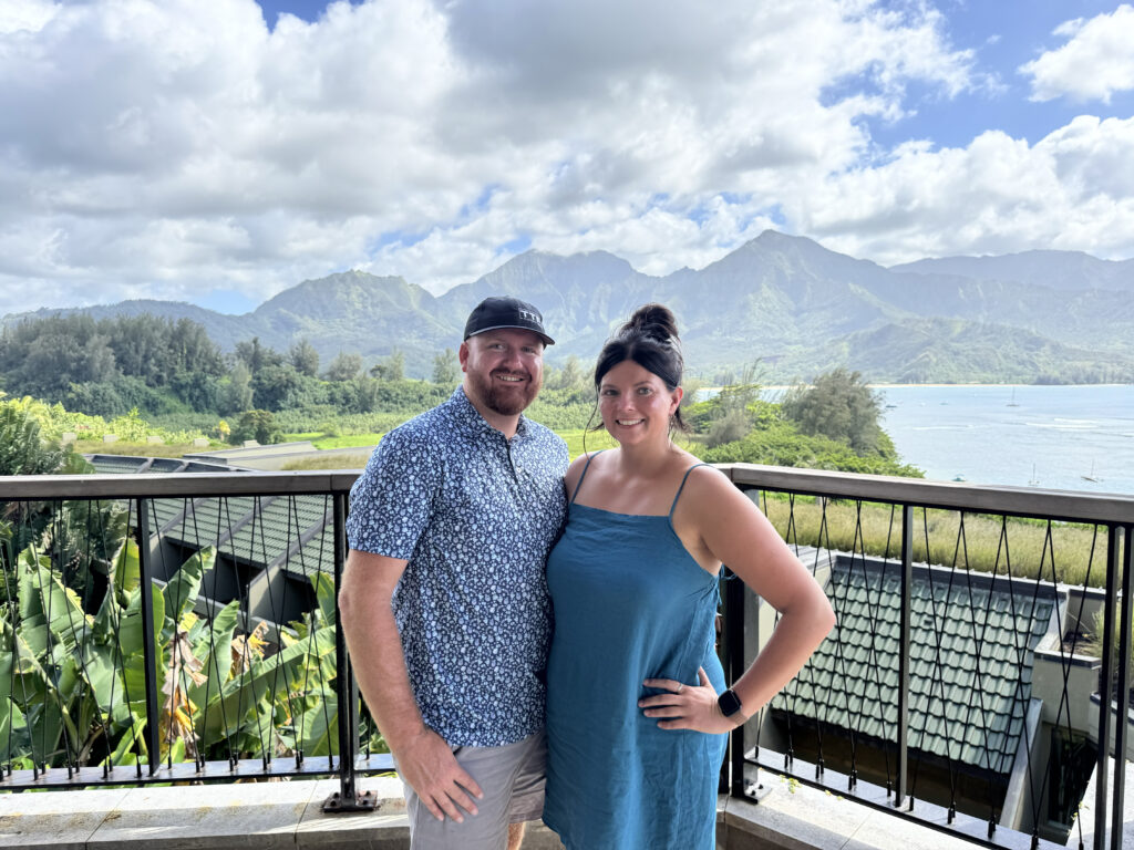 Couple overlooking Hanalei Bay from 1 Hotel Hanalei Bay balcony