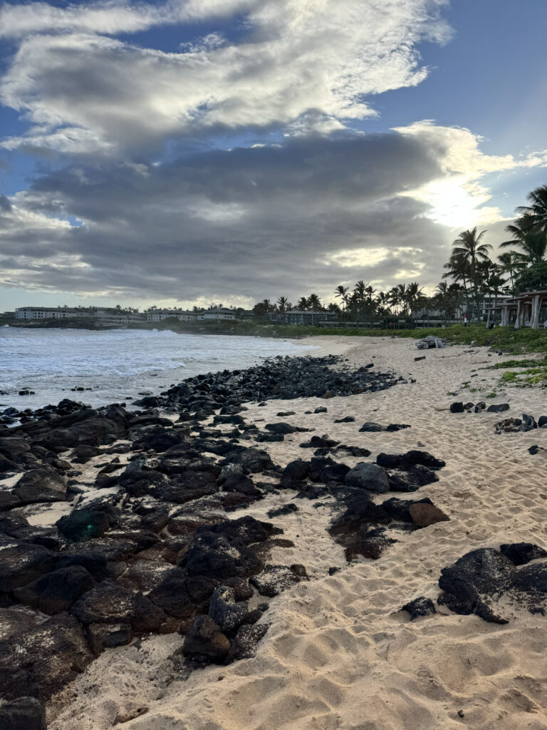 Rocky shoreline with lava rocks at Shipwreck Beach Kauai