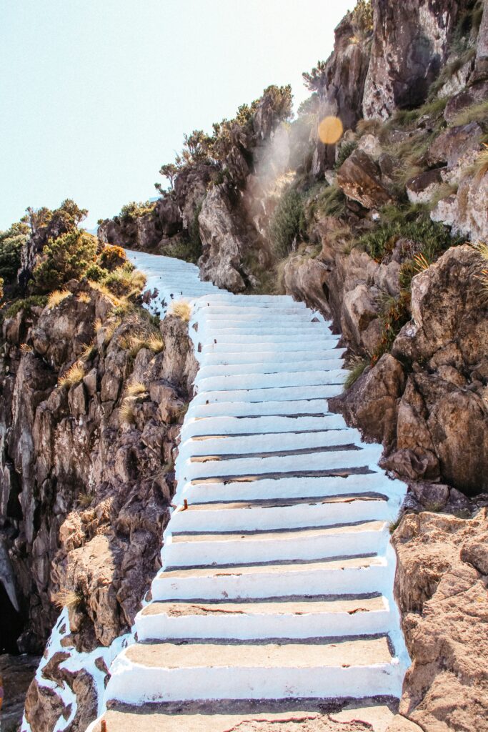 White washed stairs up a rocky hillside in the Azores Islands.